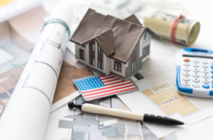 VA Construction-to-Permanent Loan Pros, Cons, and Eligibility - VA Construction Loan - VA Construction Loan VA construction loan concept showing home blueprints, and U.S. flag